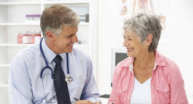 doctor talking to an older female patient