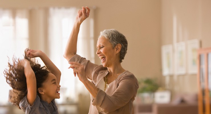 grandmother dancing with granddaughter