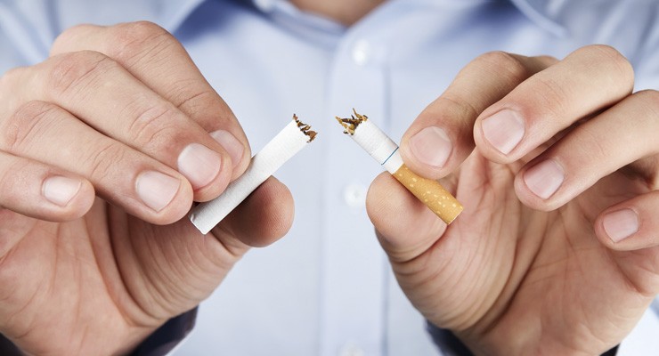 person breaking a cigarette